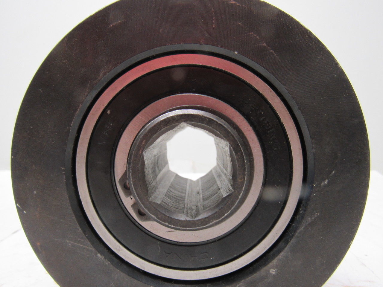 Dematic 4-13/16" OD x 2-5/8" Crowned Face End Roller 1-1/16" Hex Bore