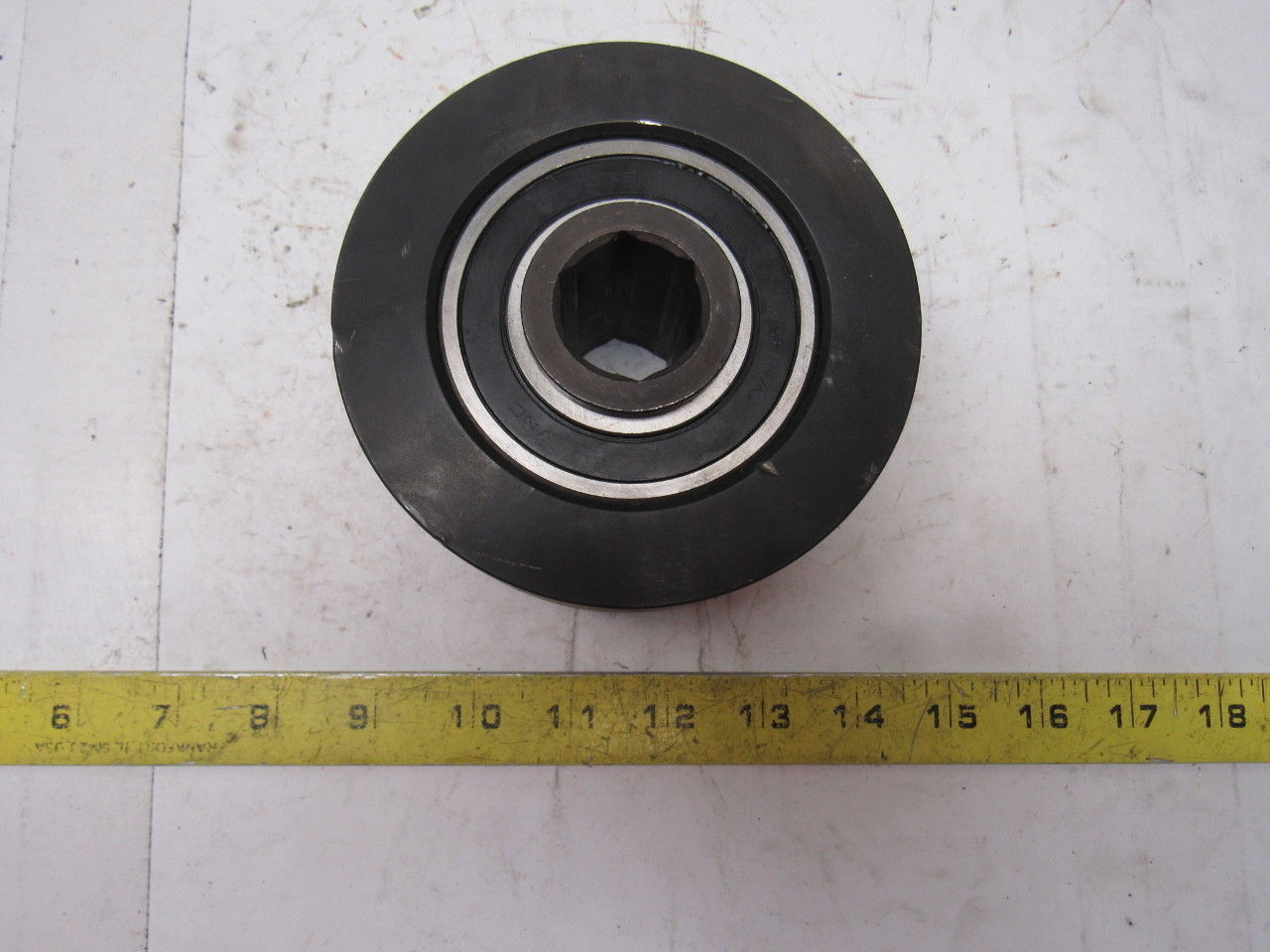 Dematic 4-13/16" OD x 2-5/8" Crowned Face End Roller 1-1/16" Hex Bore